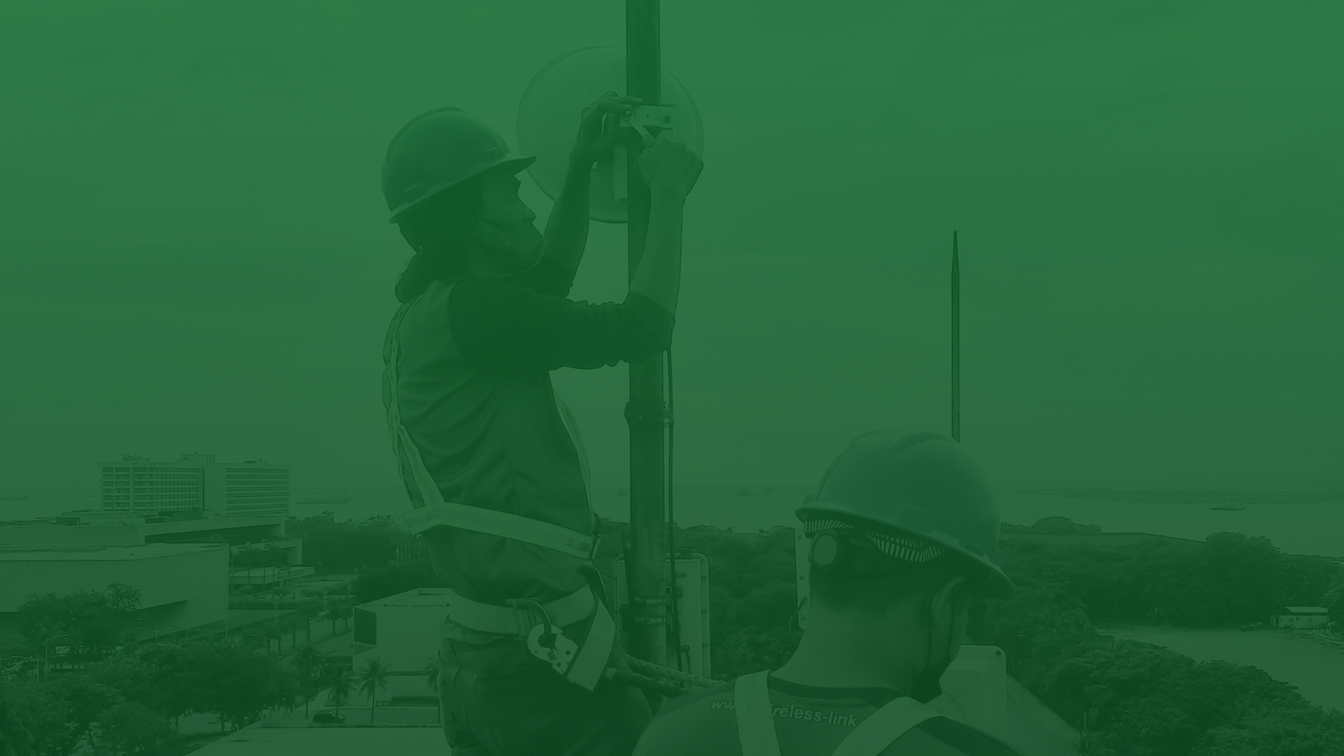 Wireless Link technicians installing network equipment